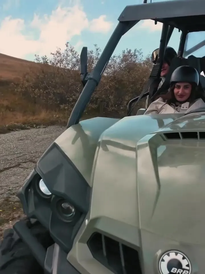 Smiling passenger in a helmet in a buggy