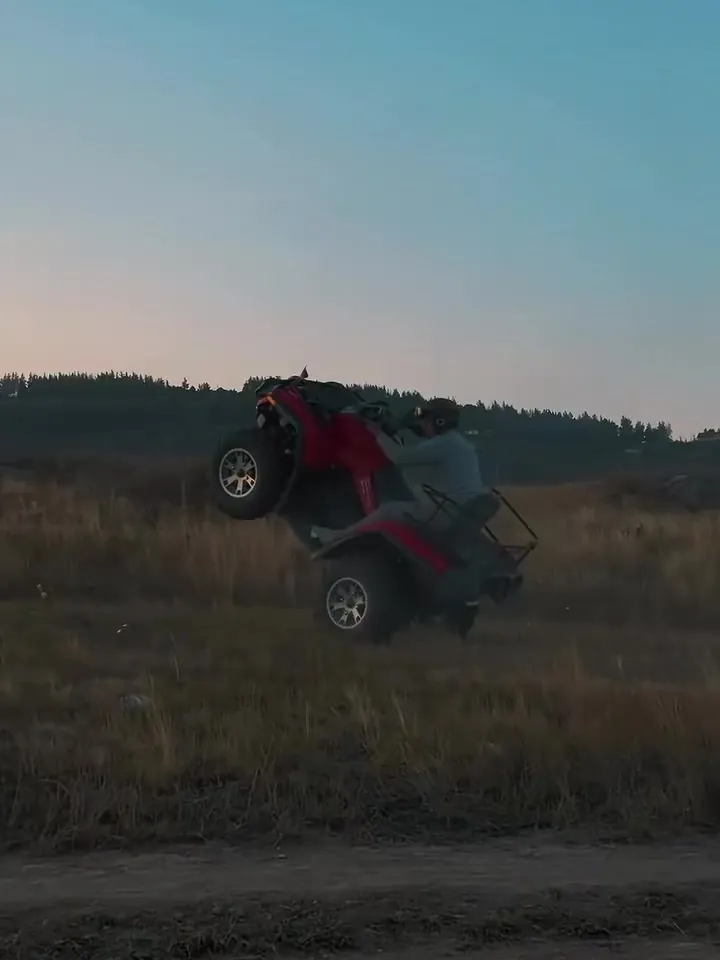 ATV on a mountain meadow at dusk
